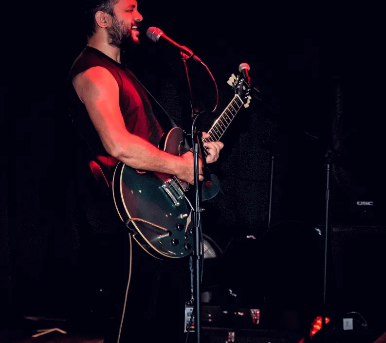 Animated live performance by Saurav MP singing and playing guitar