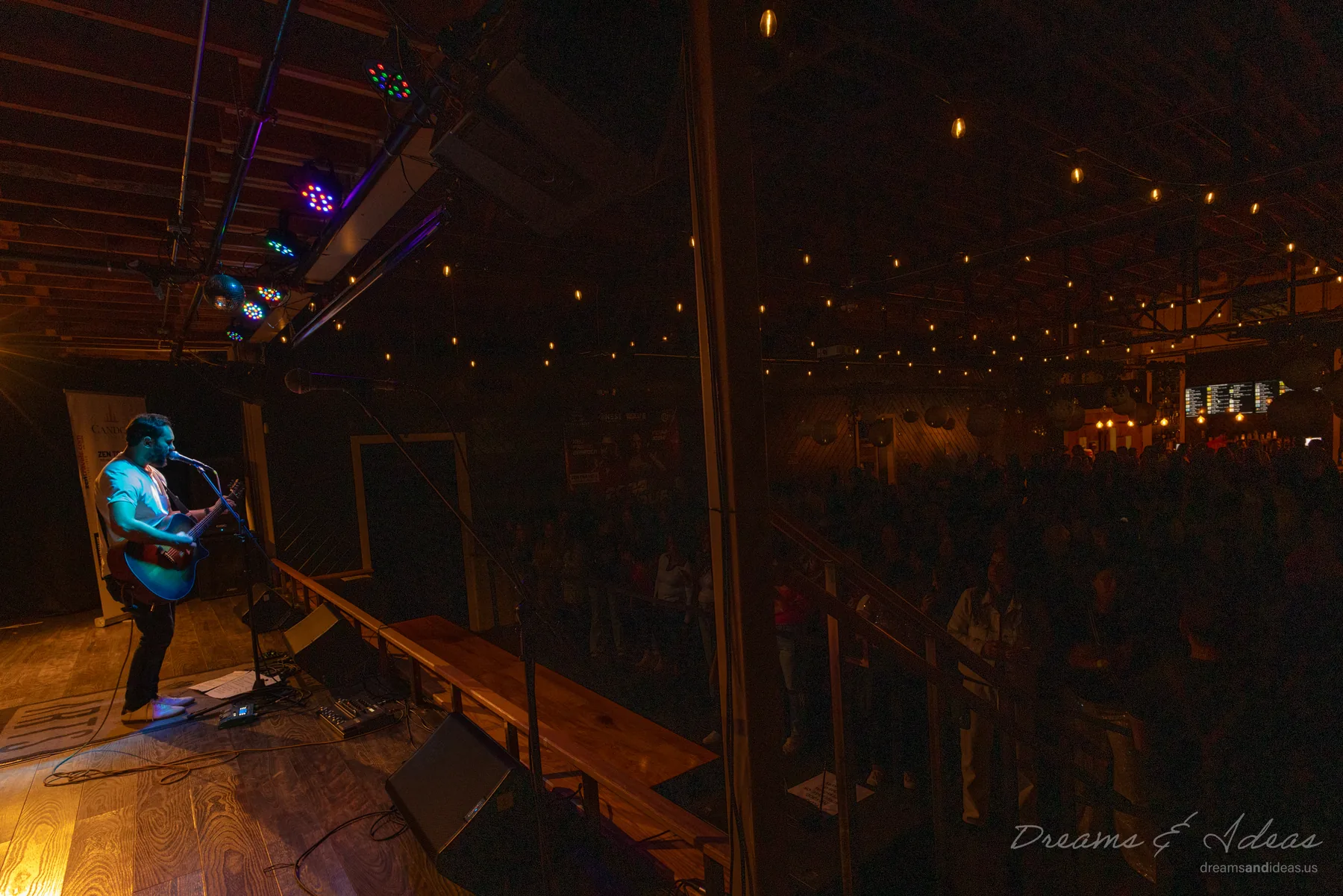 Saurav MP performing on stage in front of an audience