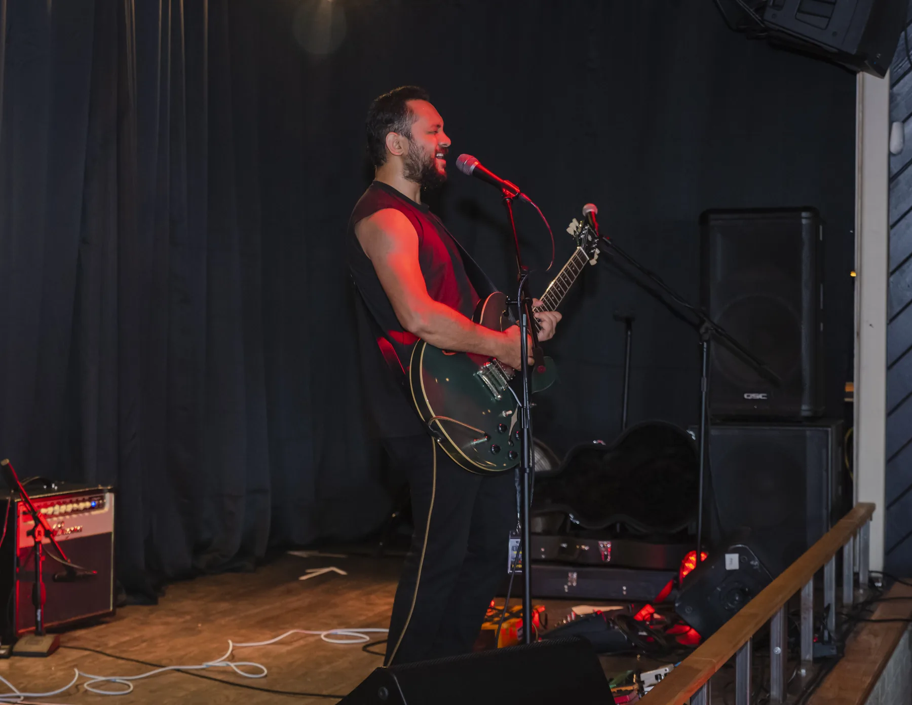 Saurav MP playing electric guitar at a live show