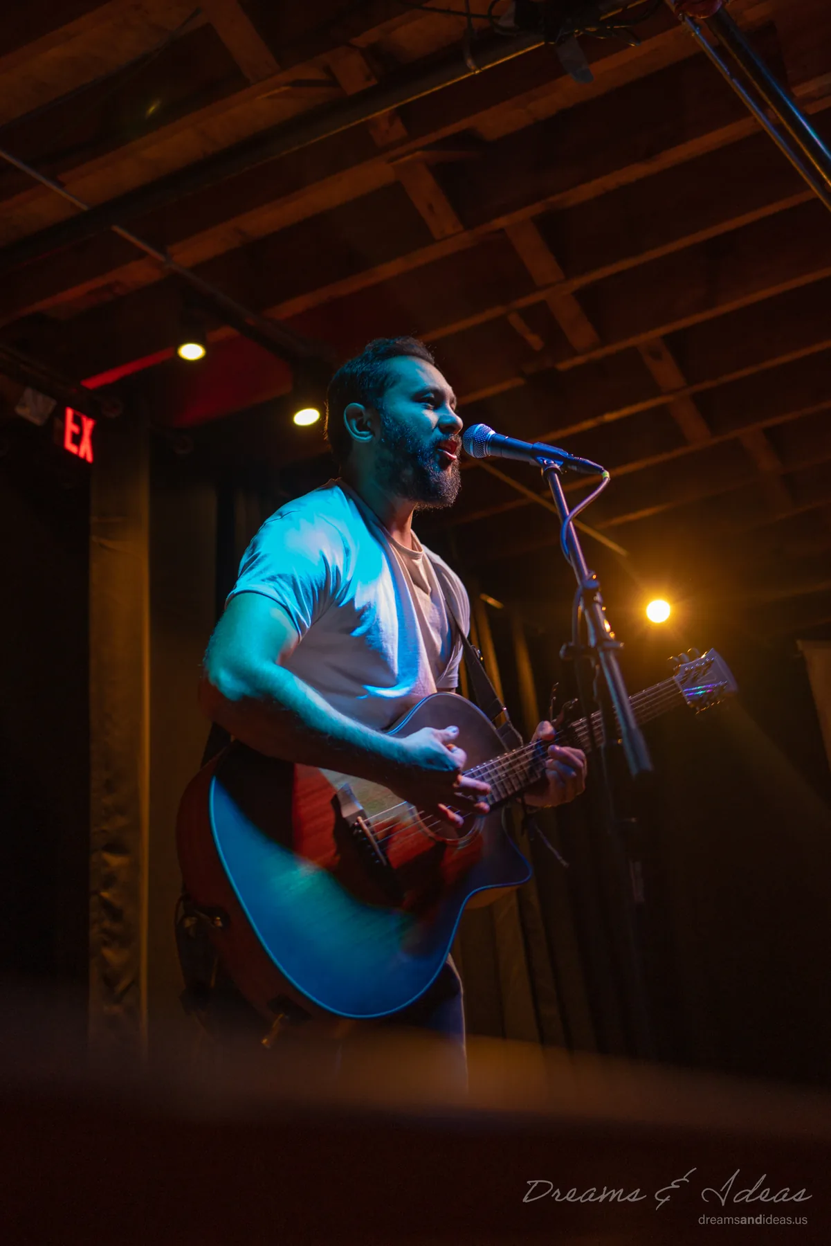 Saurav MP playing guitar during a live set
