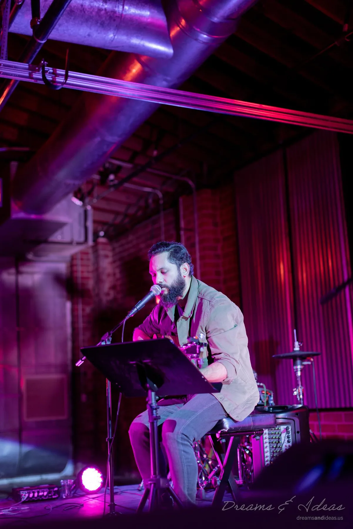 Saurav MP playing a live set under purple lights
