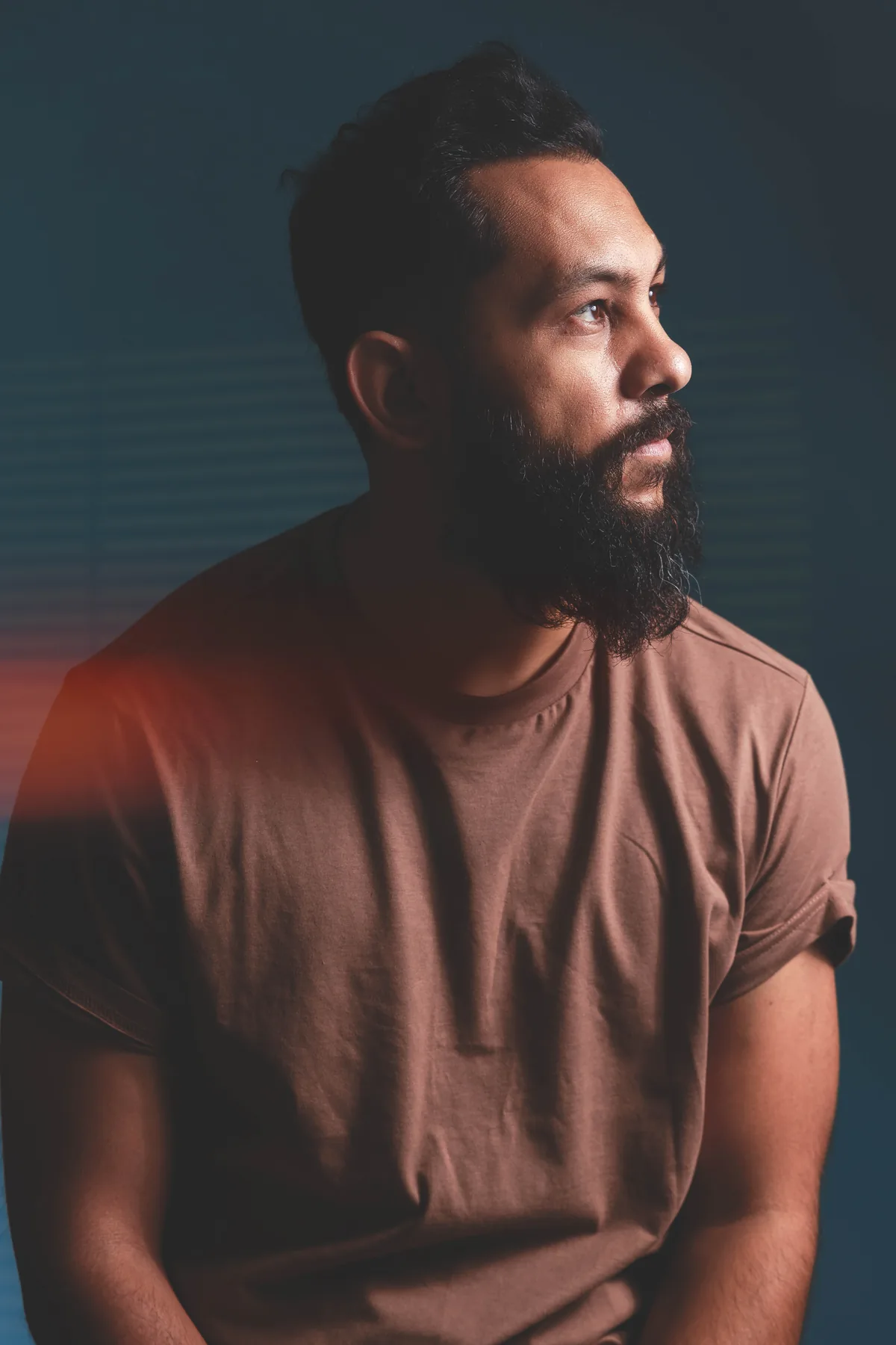Studio portrait of Saurav MP looking to the side