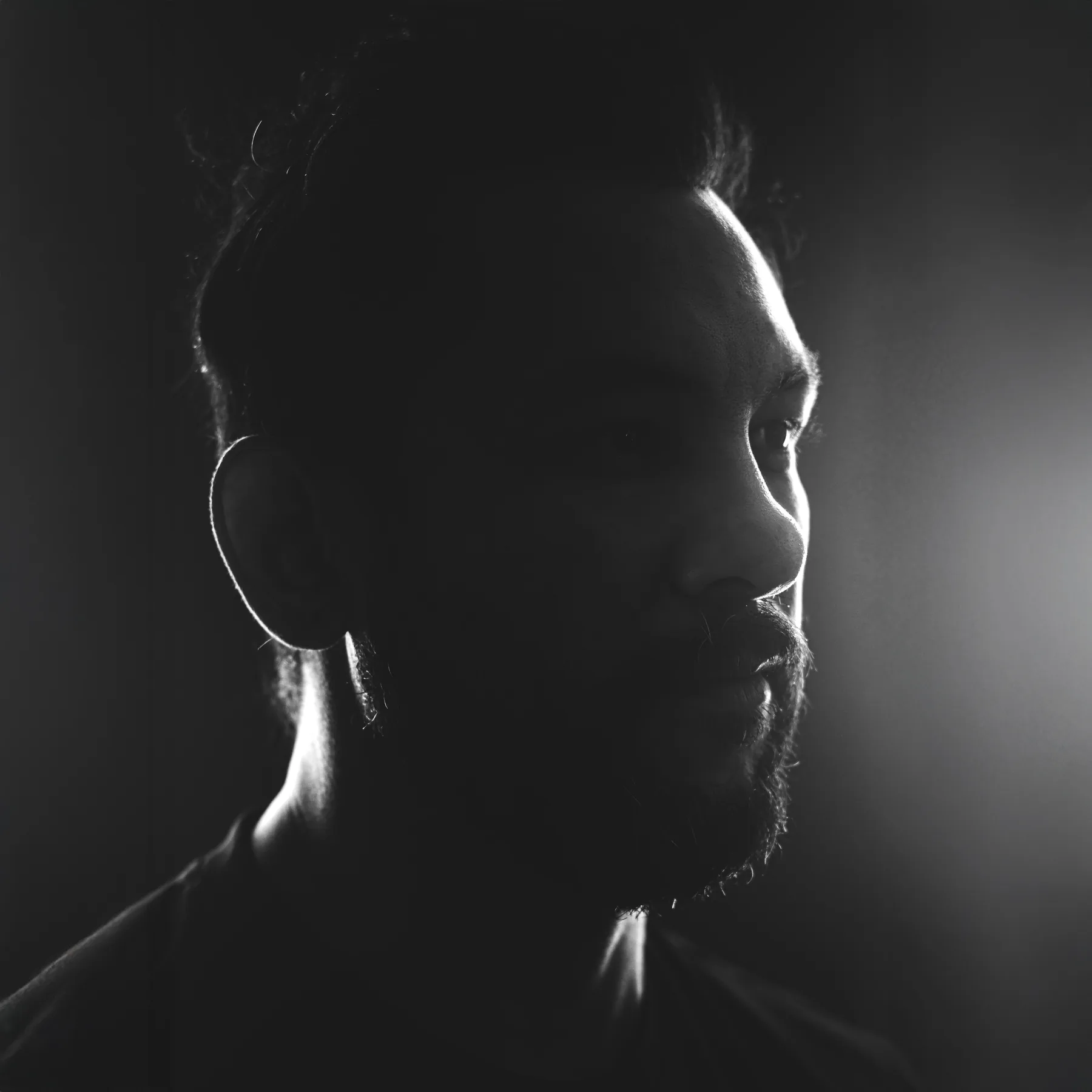 Black and white profile portrait of Saurav MP